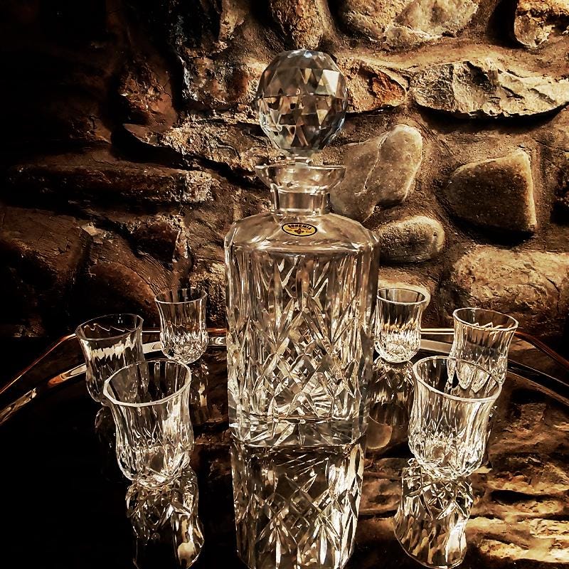 1960s Set with a Stunning Bottle and 6 Glasses in Hand-Worked Crystal of Bohemia with the Original Label.