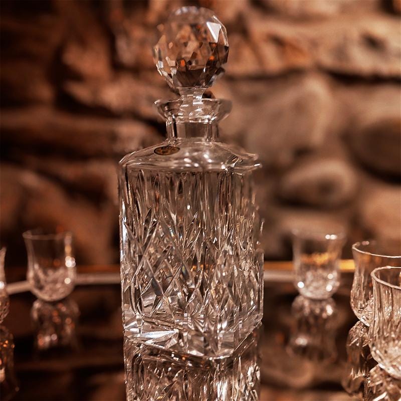 1960s Set with a Stunning Bottle and 6 Glasses in Hand-Worked Crystal of Bohemia with the Original Label.