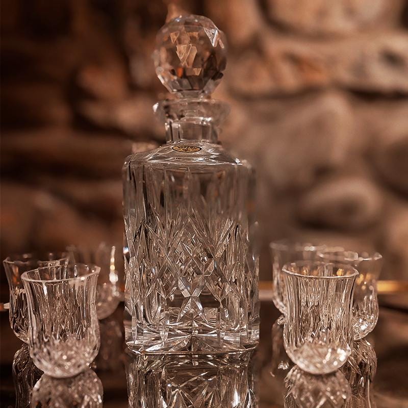 1960s Set with a Stunning Bottle and 6 Glasses in Hand-Worked Crystal of Bohemia with the Original Label.