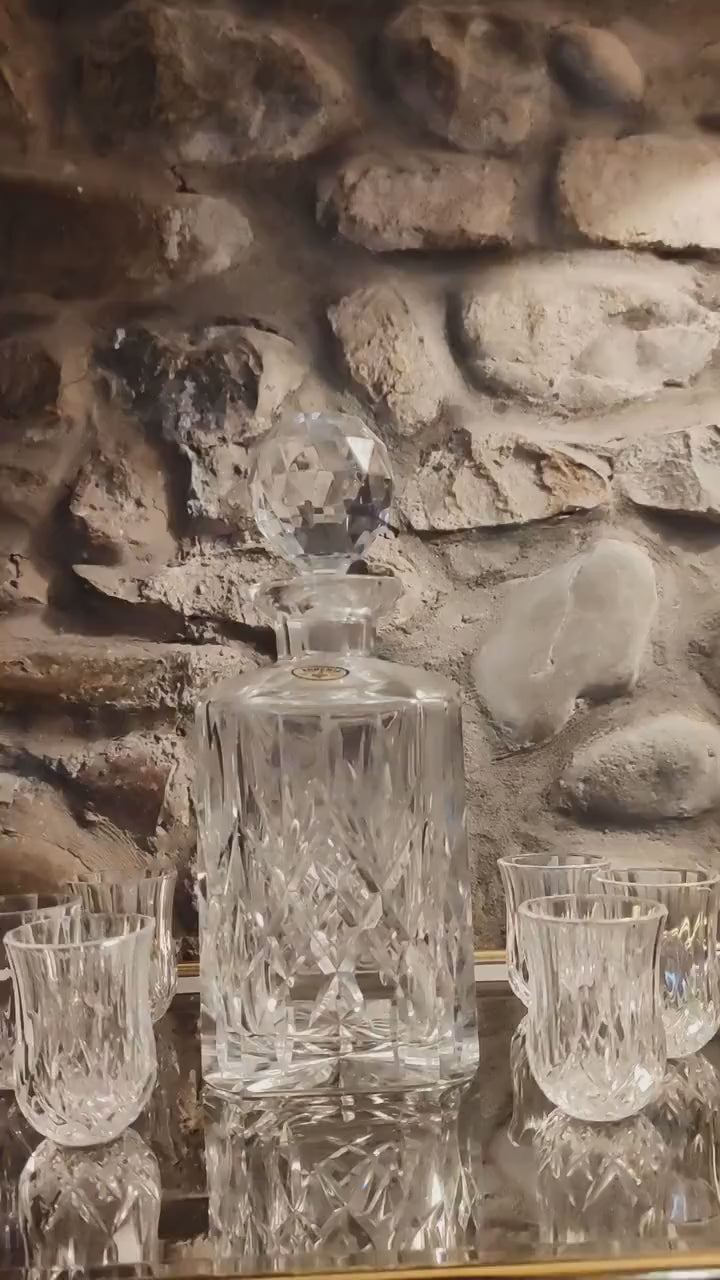1960s Set with a Stunning Bottle and 6 Glasses in Hand-Worked Crystal of Bohemia with the Original Label.